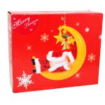 HS1204-12 BATTERY OPERATED SLEEPING SANTA ON THE MOON